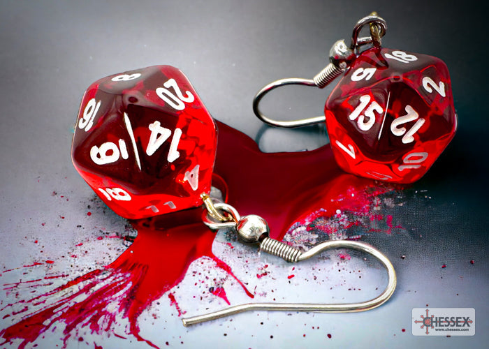 Red dice-shaped earrings with white numbers on a gray background