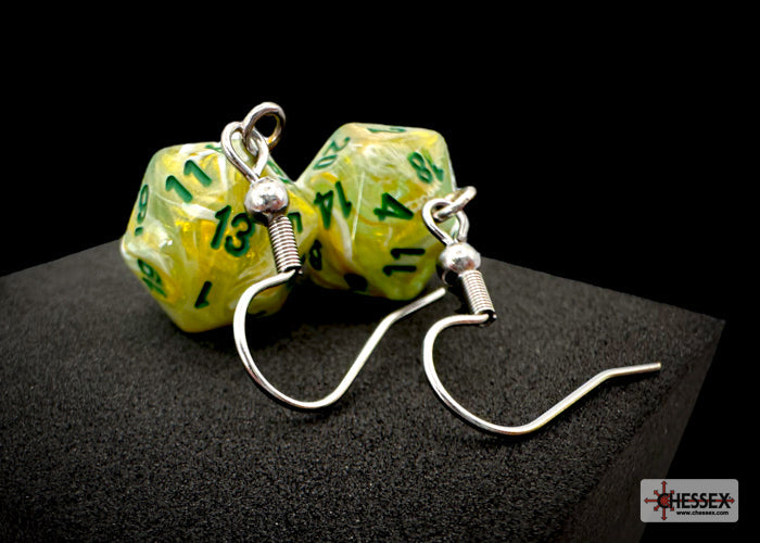 Dice-shaped earrings with green numbers on a black background