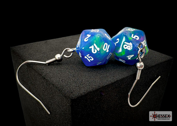 Blue and green polyhedral die earrings on a black stand with a Hessec logo.