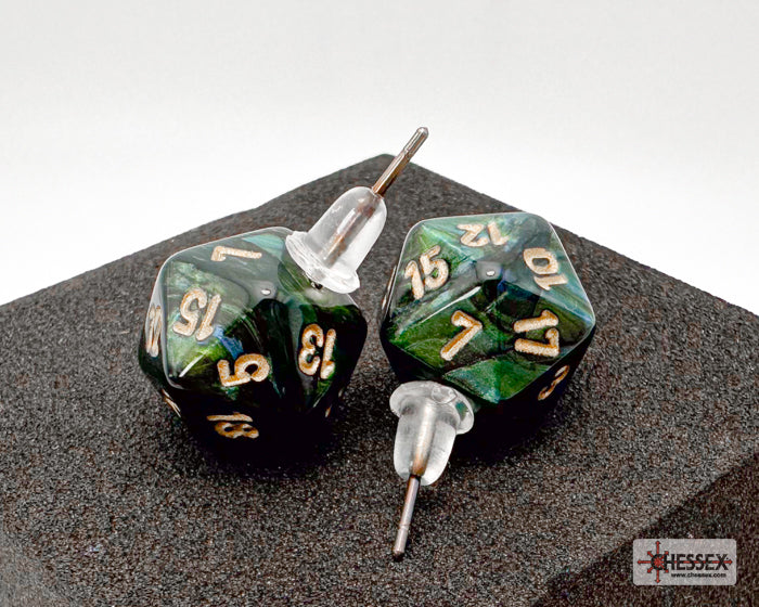 Two green polyhedral dice with gold numbers on a dark surface, branded 'Essex'.