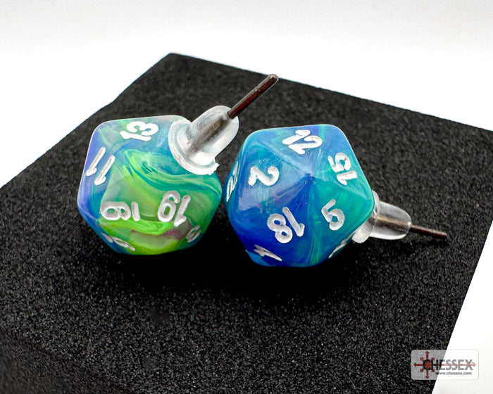 Two blue and green dice with white numbers on a black surface, branded 'Essex'.