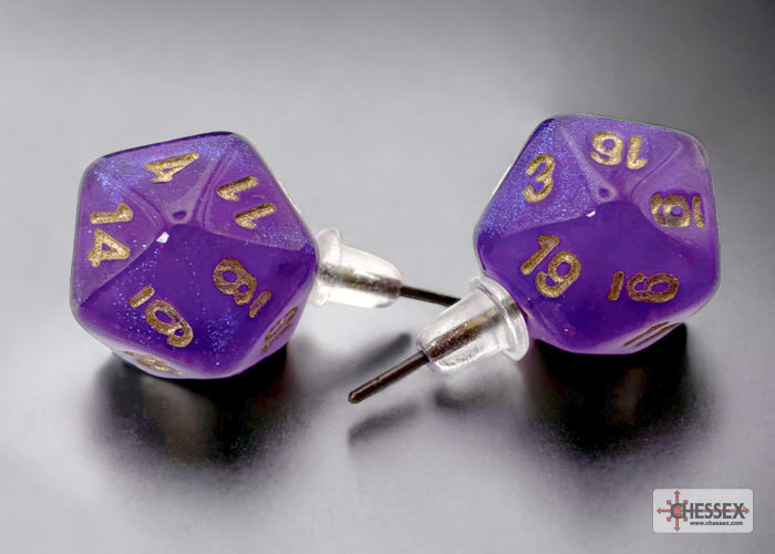 Purple dice-shaped earrings with gold numbers on a gray background, featuring the Chessex brand.