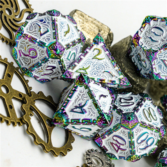 Colorful polyhedral dice with metallic sheen on a white background