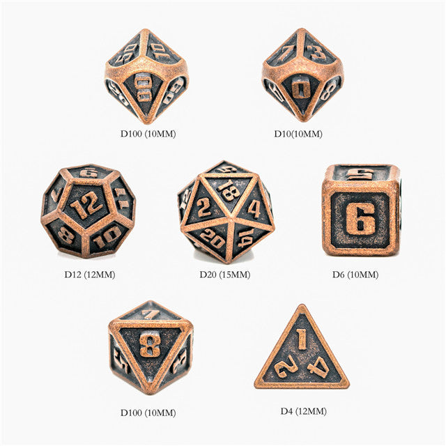 Set of metal dice with bronze and black design on a white background