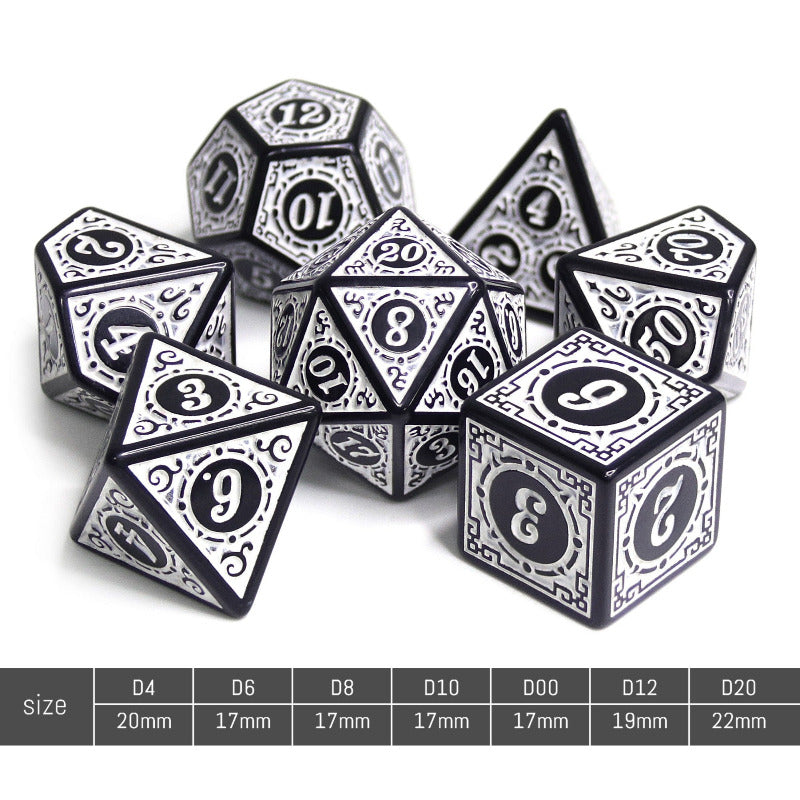 Set of black and silver polyhedral dice with numbering on a white background