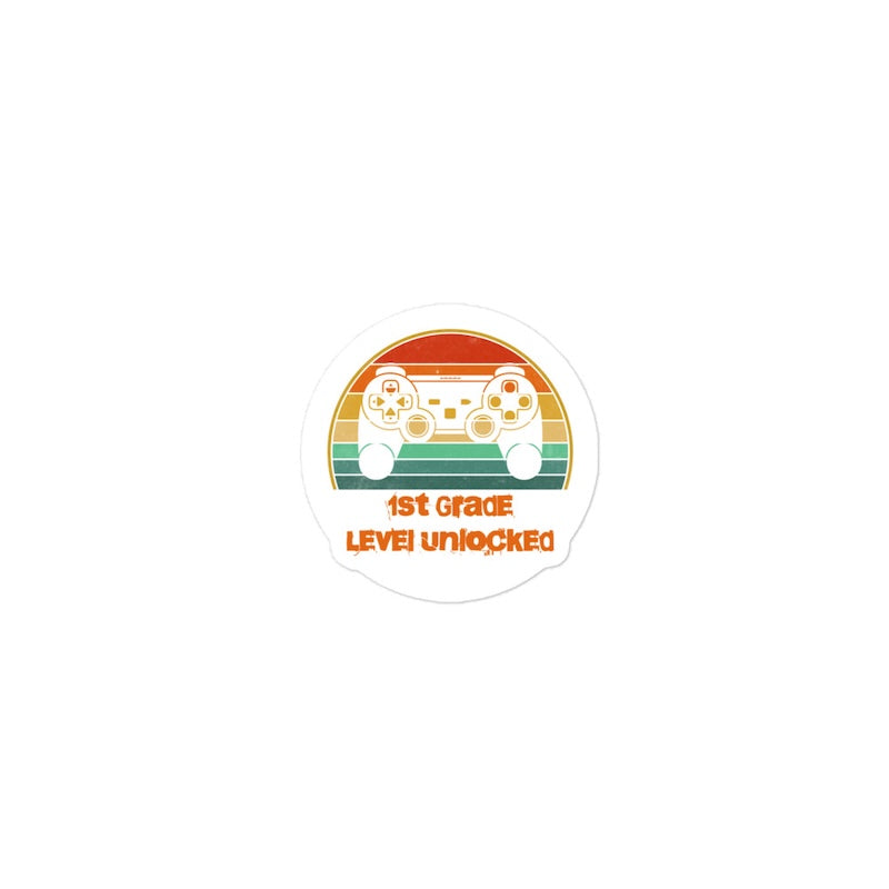 Sticker with a gaming controller design and '1st Grade Level Unlocked' text on a white background