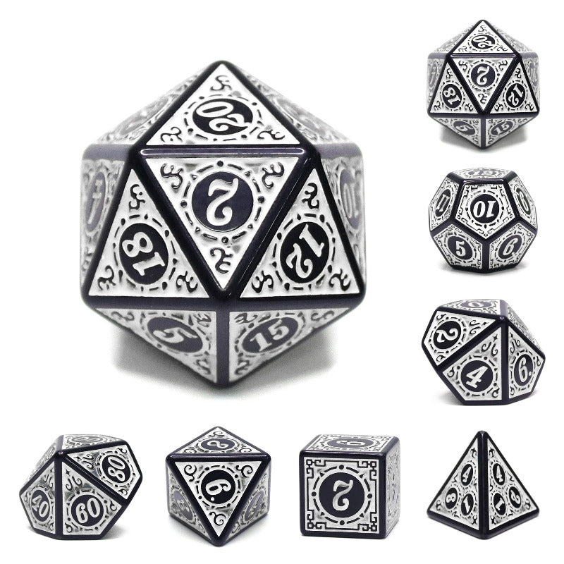 Set of silver and black polyhedral dice on a white background