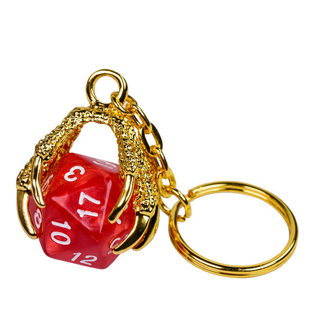 Red die with gold dragon-like holder on a white background