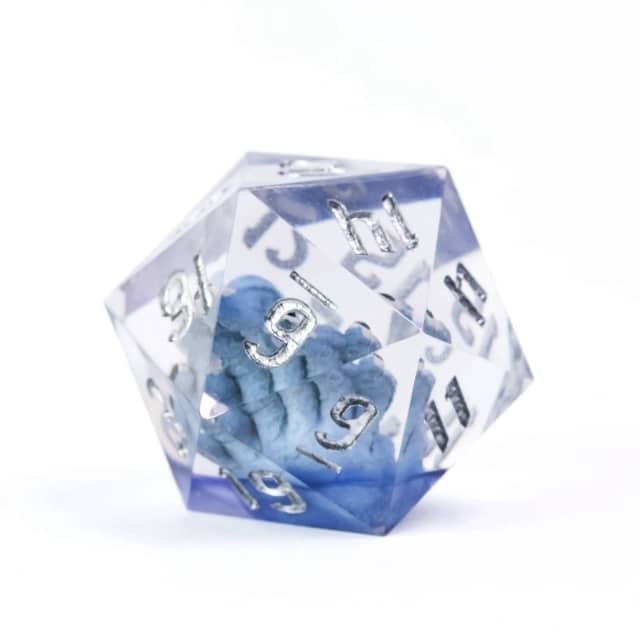 Clear polyhedral dice with blue interior and white numbers on a white background