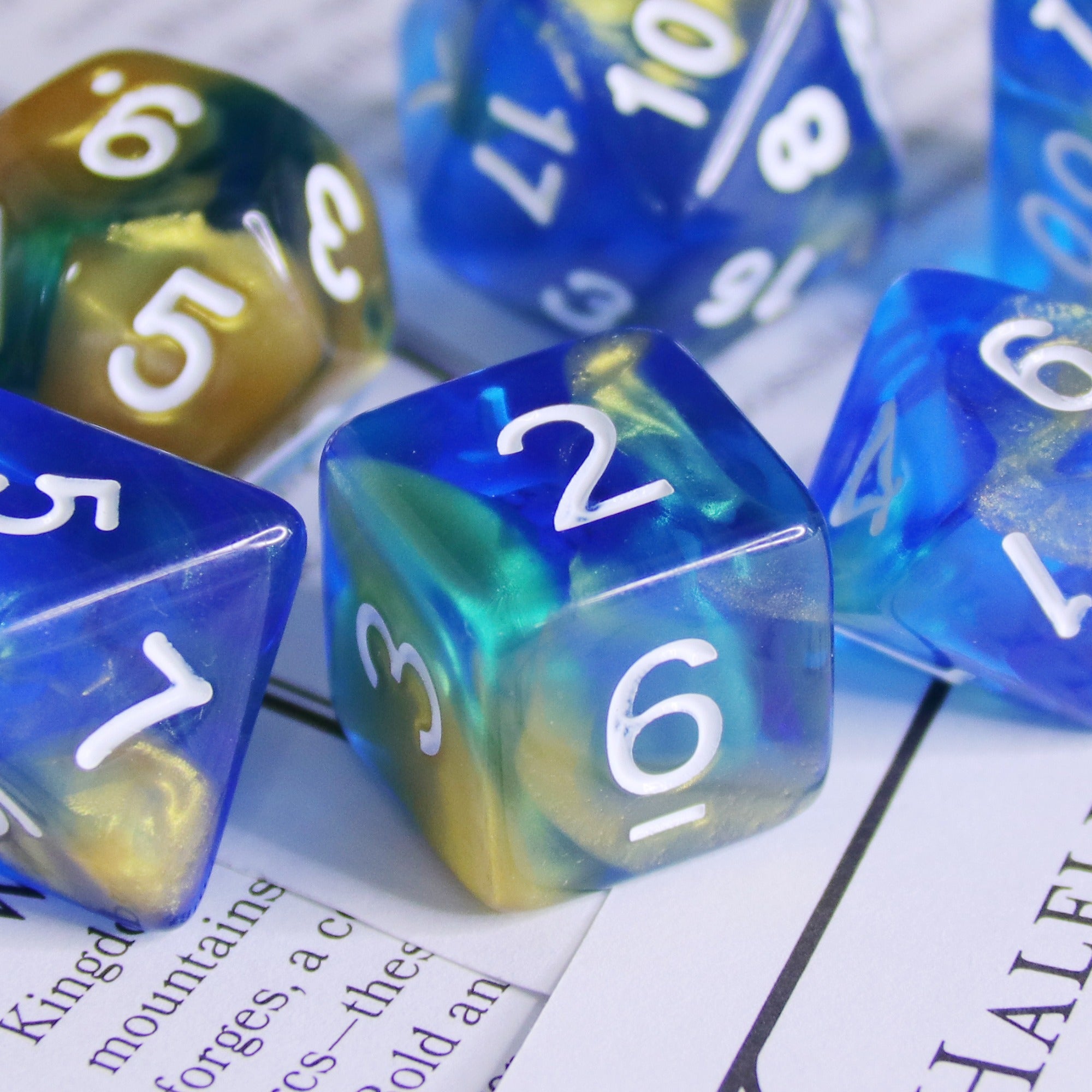 Set of colorful polyhedral dice on a printed surface