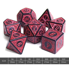 Set of red and black polyhedral dice with metallic sheen on a gray background