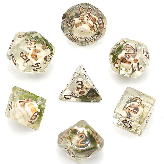 Set of seven dice with metallic gold numbers on a white background
