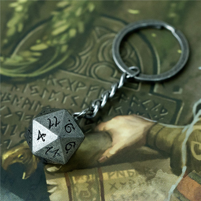 Keychain with a metal die on a fantasy-themed map background