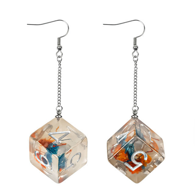 Clear cube-shaped earrings with embedded colorful stones on a white background