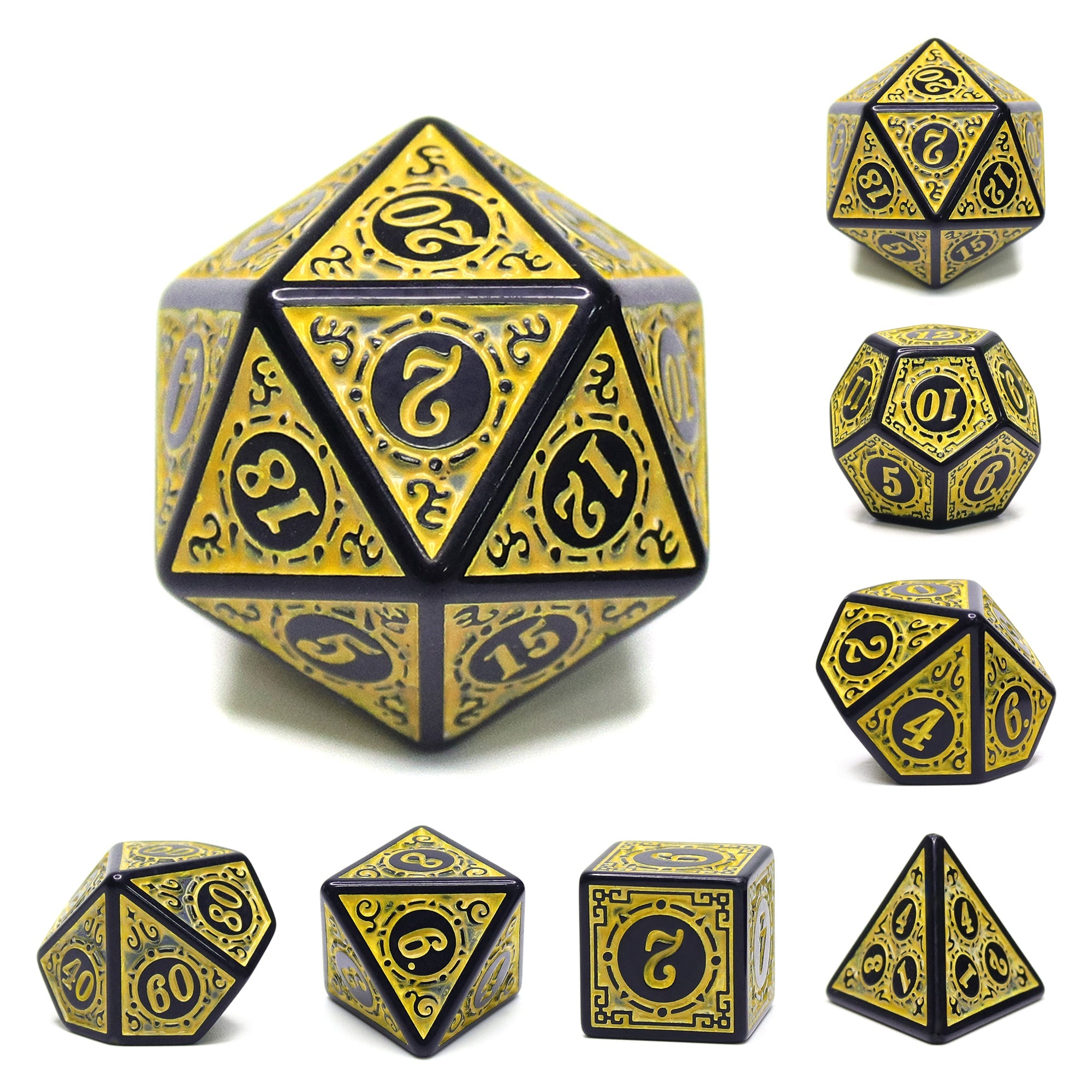 Set of black and gold polyhedral dice on a white background