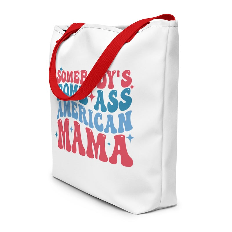 White tote bag with colorful text and red handles on a white background