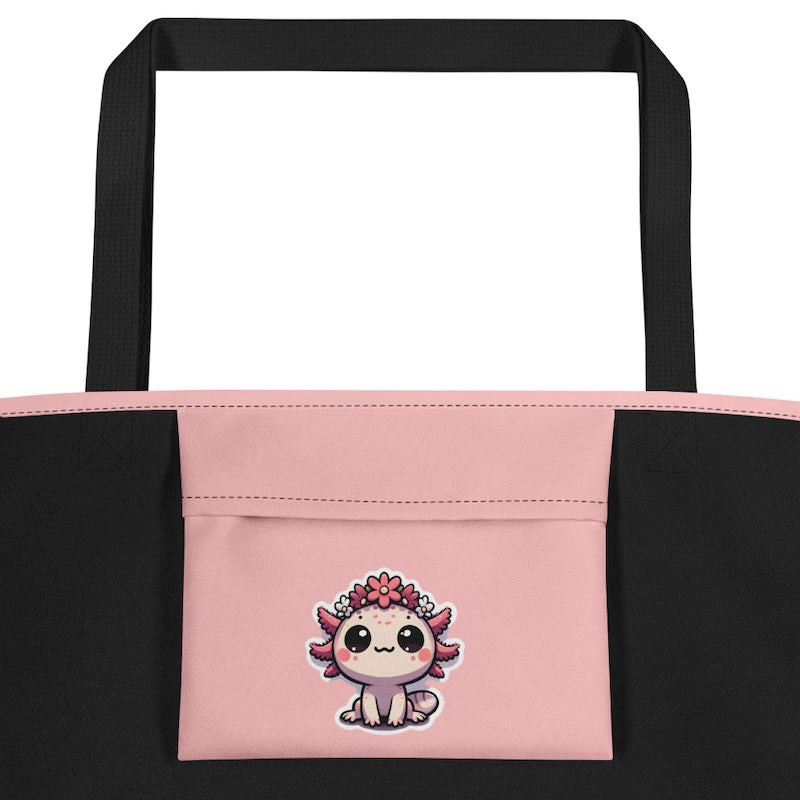 Black tote bag with a pink pocket featuring a cute cartoon character on a white background