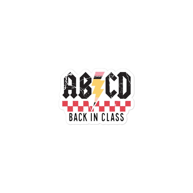Sticker with 'ABCD Back in Class' text and a checkered design on a white background