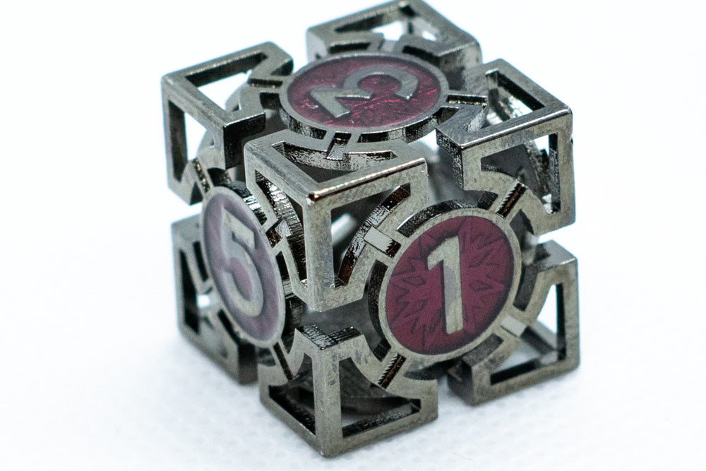 Metallic puzzle cube with numbered red faces on a white background