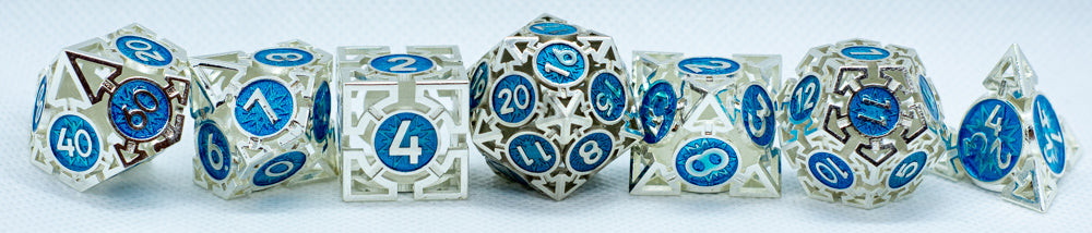 Set of metal dice with blue and silver numbering on a white background