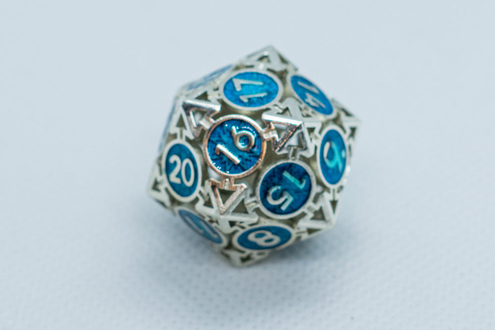 D20 polyhedral dice with blue and silver numbers on a light gray background