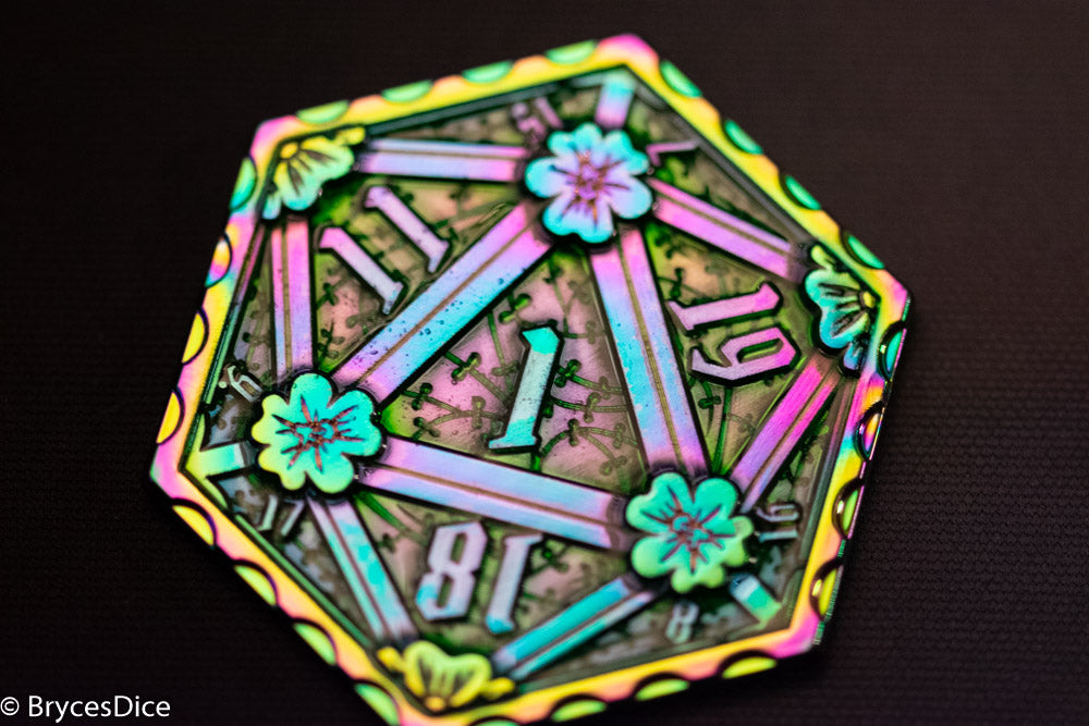 Colorful die with glowing numbers and floral designs on a dark background
