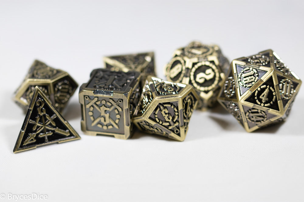 Set of metallic polyhedral dice on a white background