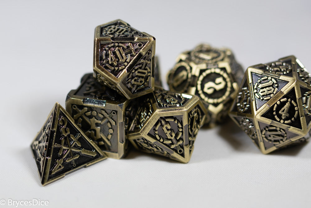 Set of metallic polyhedral dice on a white background