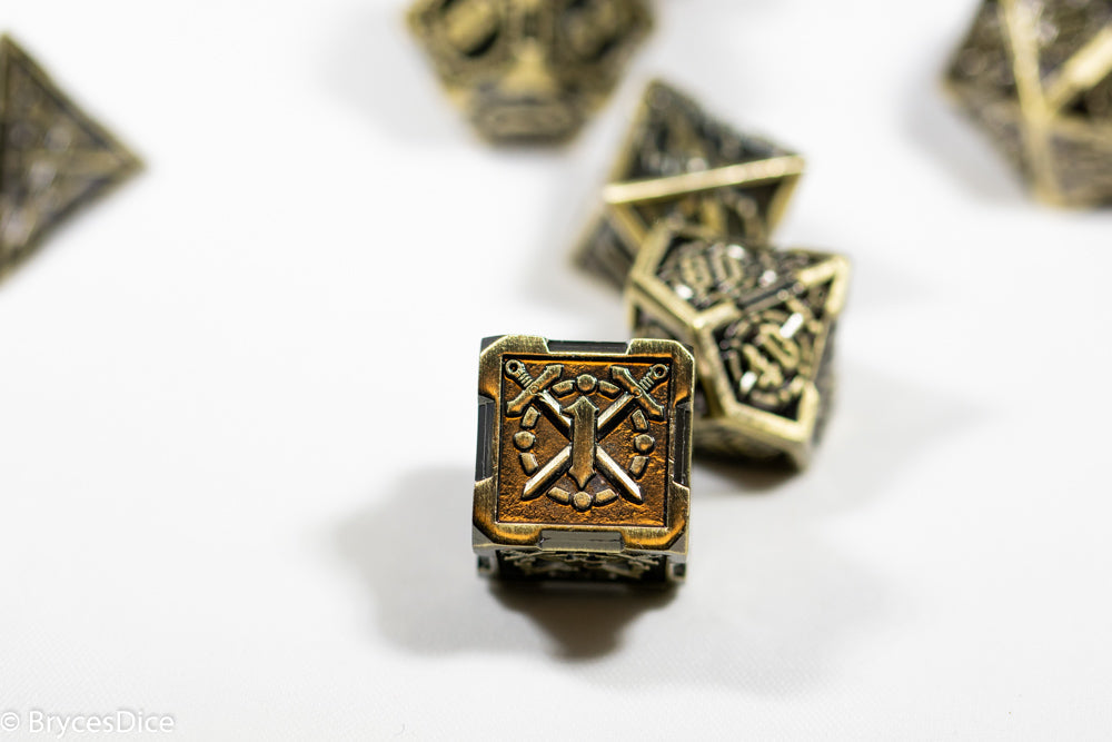 Bronze polyhedral dice with intricate designs on a white background