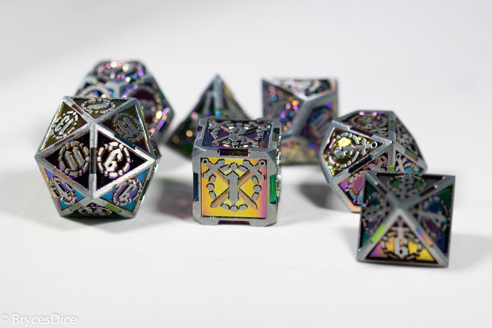 Metal dice with intricate designs on a white background