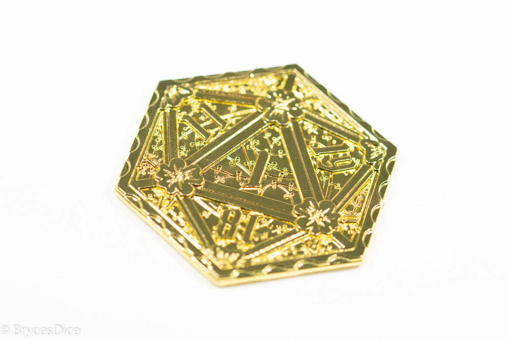 Gold polyhedral dice on a white background