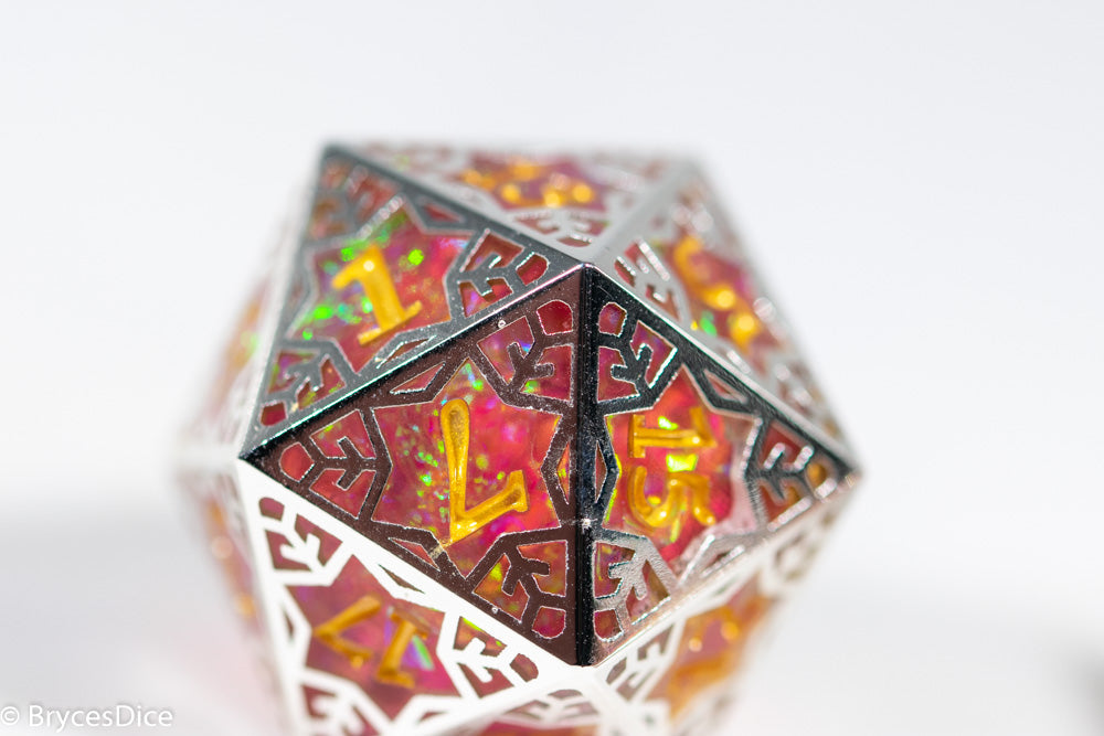 Decorative polyhedral die with intricate patterns on a white background