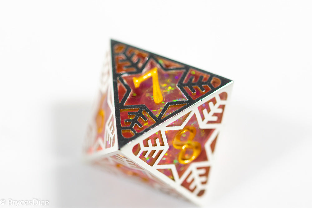 Decorative die with geometric patterns and numbers on a white background