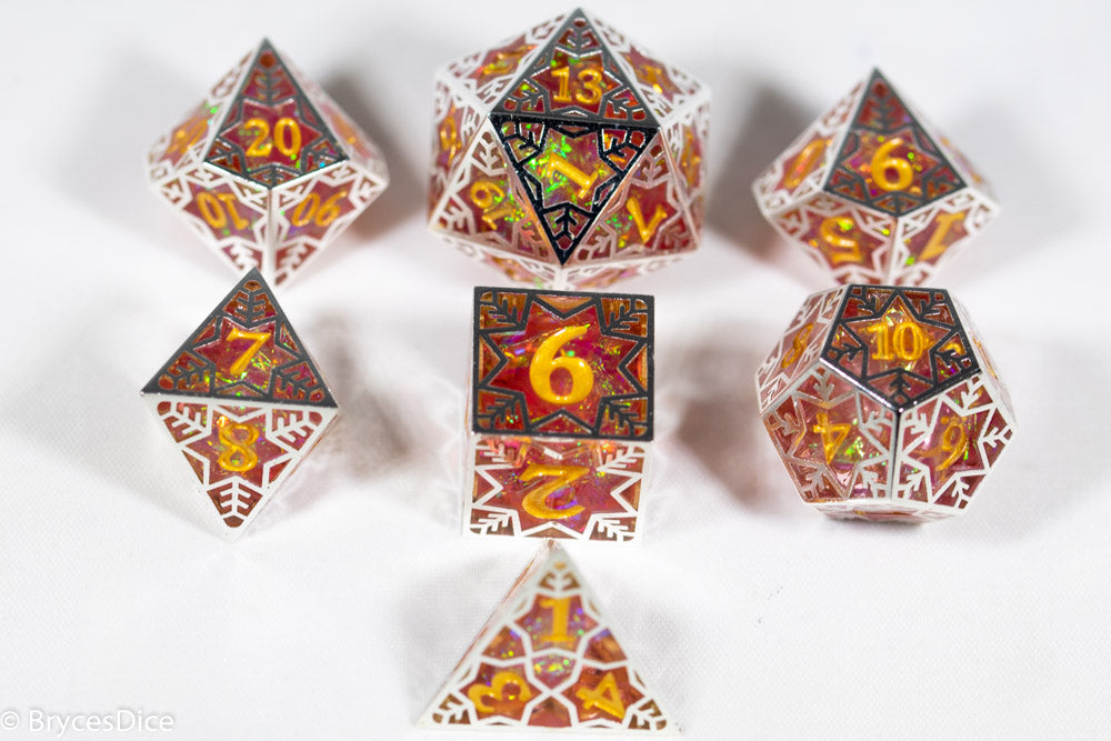 Set of polyhedral dice with intricate designs and numbers on a white background