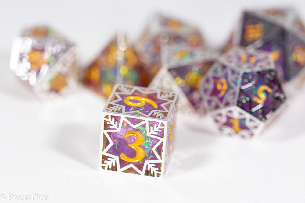 Colorful polyhedral dice with numbers on a white background