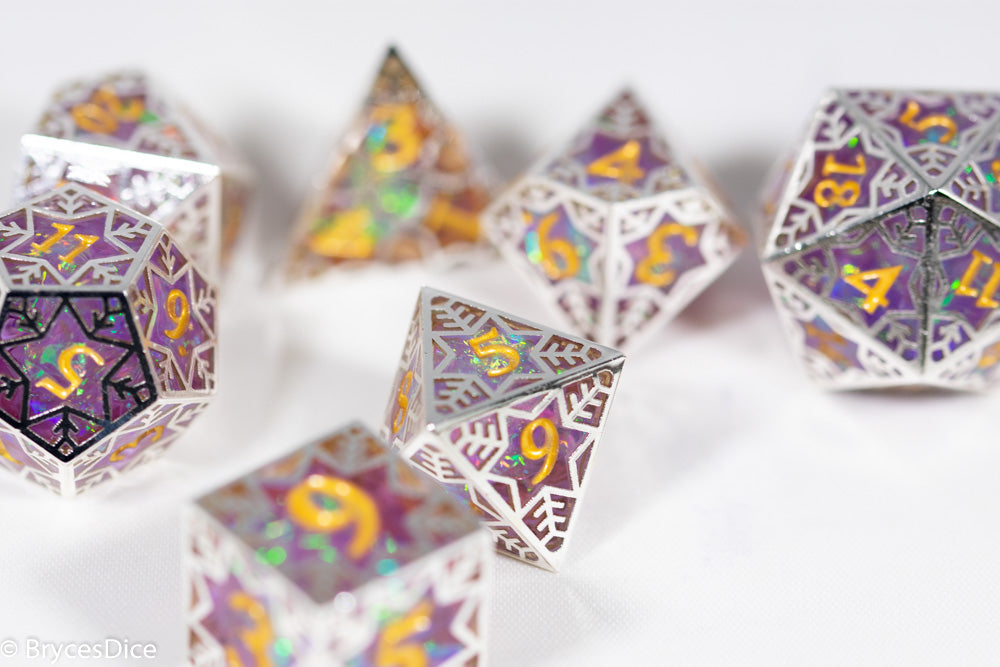 Set of polyhedral dice with decorative patterns on a white background