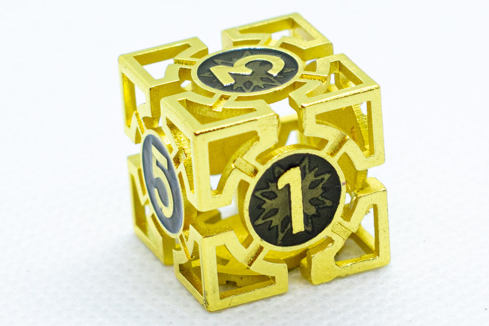 Gold metal dice with numbers on a white background