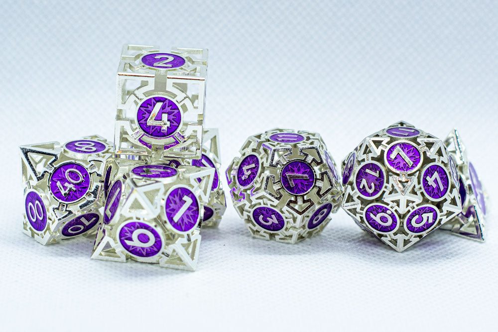 Set of polyhedral dice with purple numbers on a light gray background