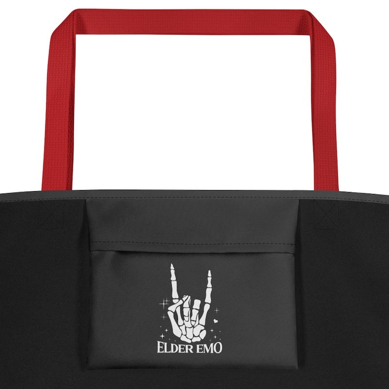 Black tote bag with red handles featuring a hand gesture logo and 'Elder Emo' text.