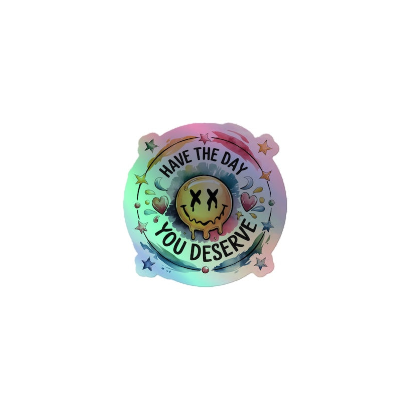 Colorful badge with smiley face and text 'Have the day you deserve' on a white background