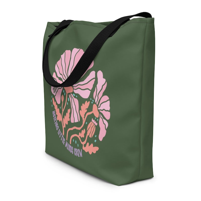 Green tote bag with pink floral design and text on a white background