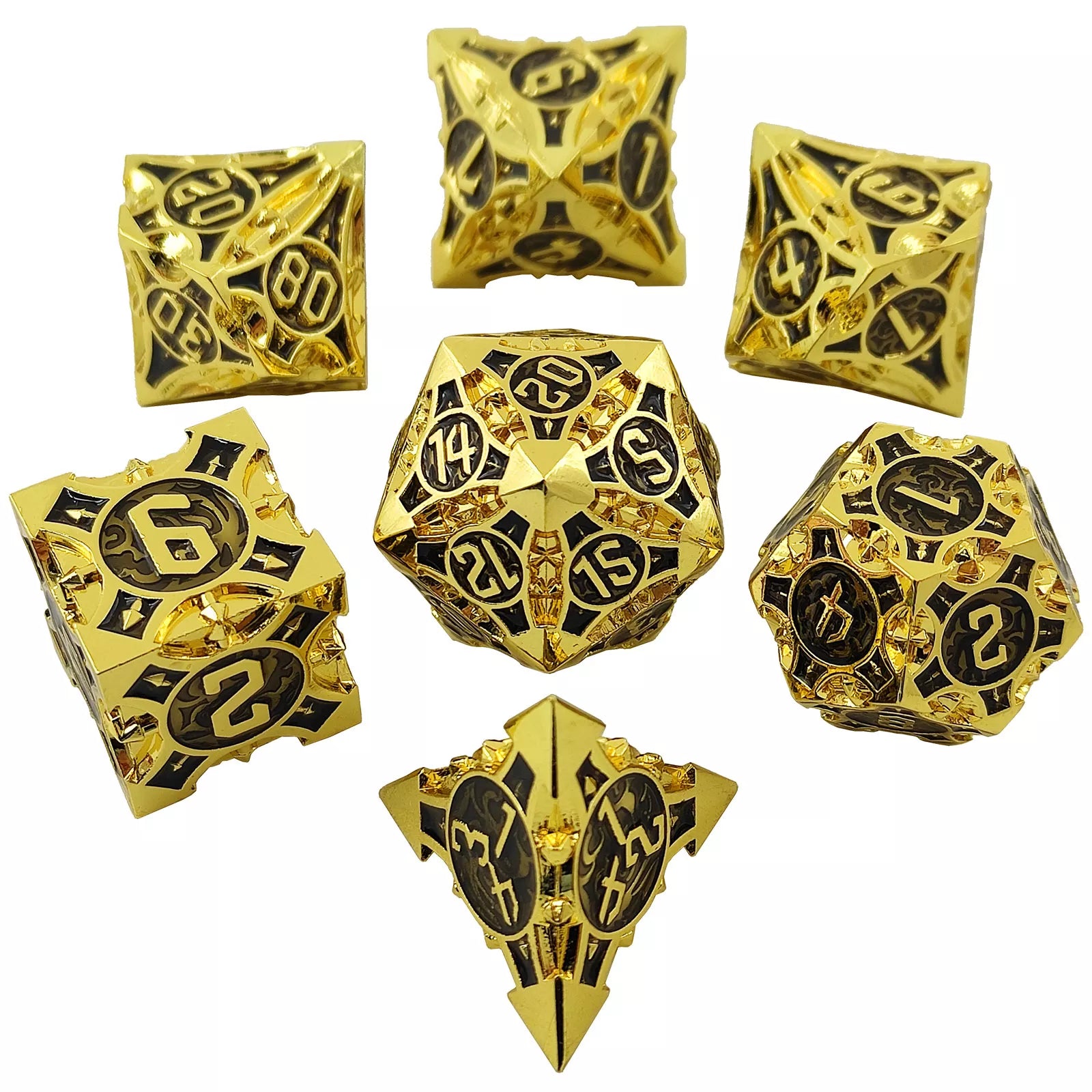 Set of gold metal dice with black numbering on a white background