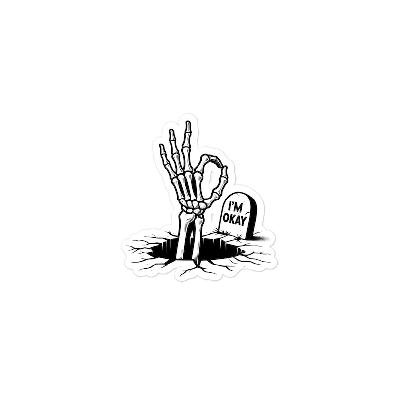 Skeleton hand making an 'OK' sign with a gravestone labeled 'I'm Okay' on a white background