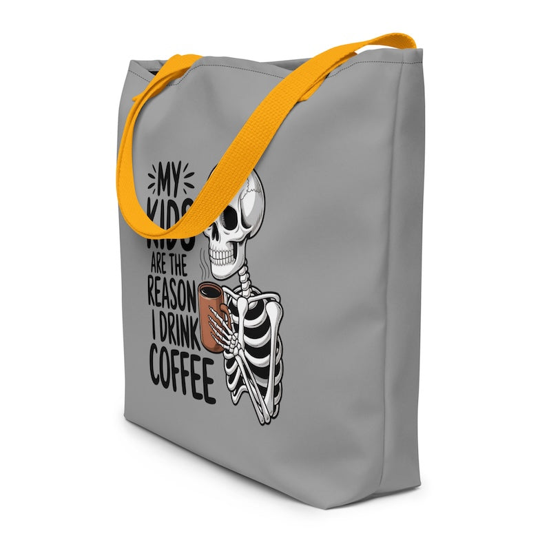 Gray tote bag with skeleton design and text on a white background