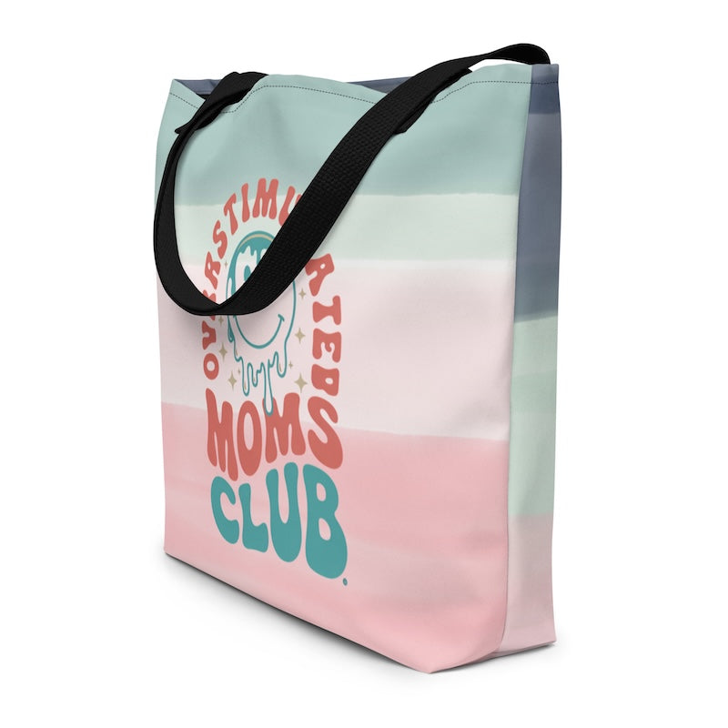 Tote bag with 'Overstimulated Moms Club' text on a gradient background
