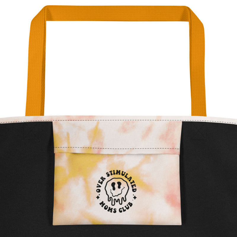 Tote bag with tie-dye design and visible brand logo on a white background