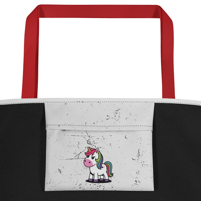 Tote bag with red handles and a unicorn design on a white background