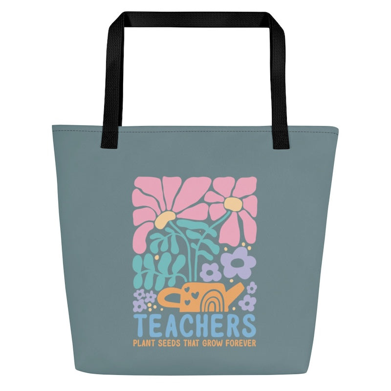Tote bag with floral design and 'Teachers Plant Seeds That Grow Forever' text on a white background