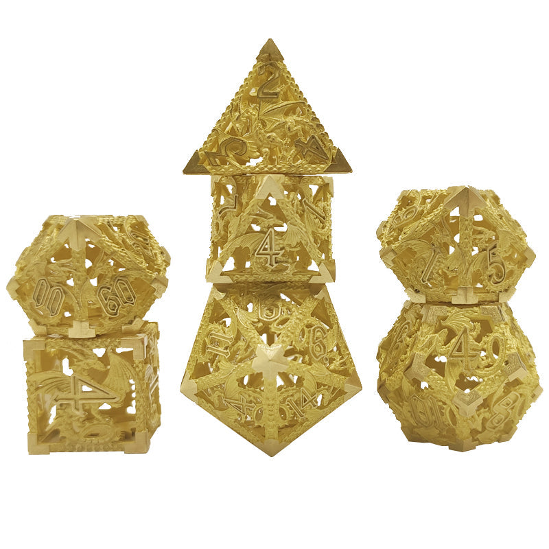 Set of gold polyhedral dice on a white background