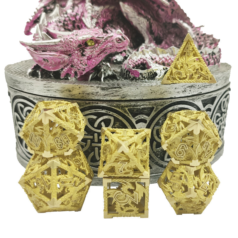 Gold polyhedral dice set with a dragon figurine in the background